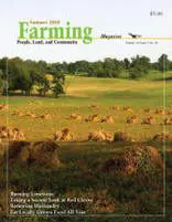 A magazine cover with a field full of animals.