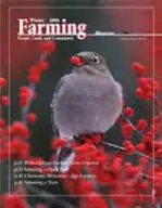 A bird with berries in its mouth on the cover of farming magazine.