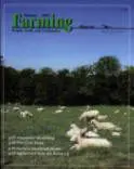 A magazine cover with sheep in the grass.