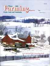 A magazine cover with snow covered farm buildings.