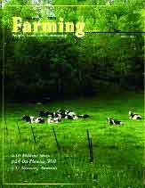 A magazine cover with cows in the grass.