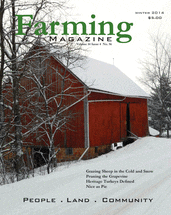 A red barn sitting in the middle of a snowy field.