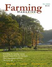 A farm with horses grazing in the pasture.