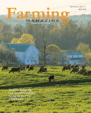 A magazine cover with cows in the background.