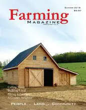 A barn sitting in the middle of a field.